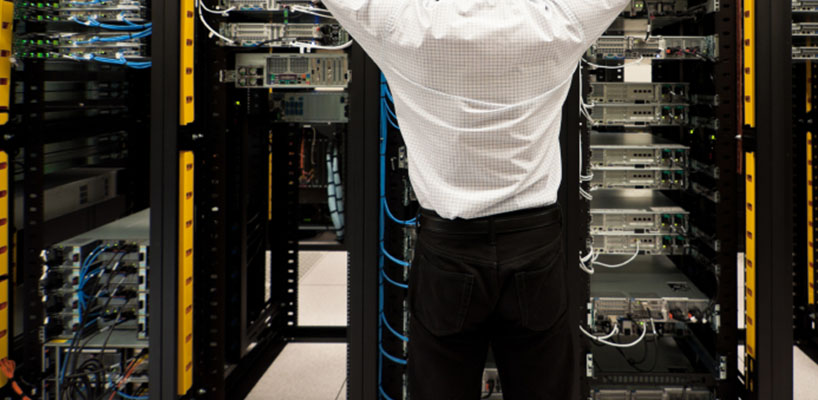 man working on computer servers