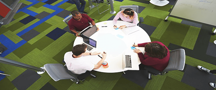 employees collaborating around table