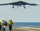 stealth aircraft landing on aircraft carrier