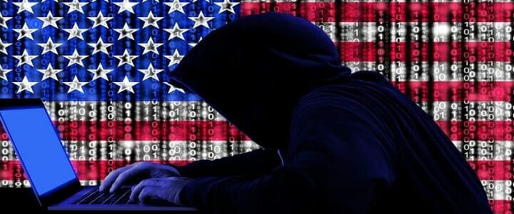 graphic of hacker with american flag over code