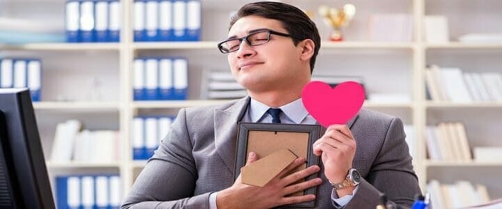 stock photo of businessman with heart and photo frame