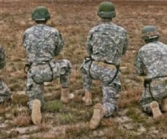 American soldiers kneel