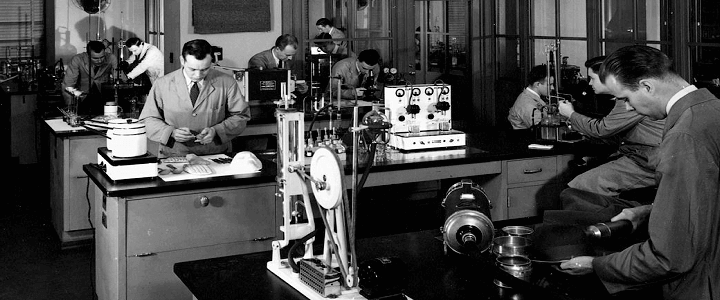 historic photo of men working in FBI cold war lab