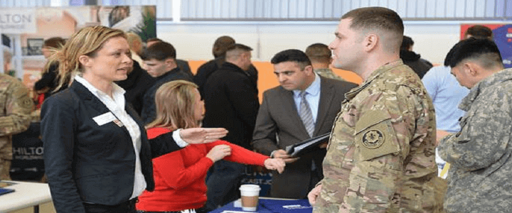 woman and man talking at army spouse career fair