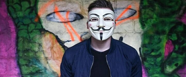 stock photo man wearing Guy Fawkes Anonymous mask