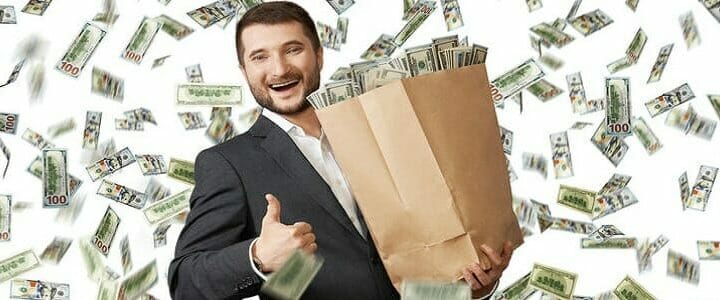 stock photo of man with bag of money and money raining down