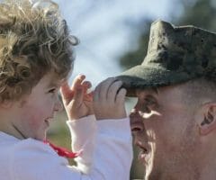 Marine with daughter outside