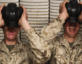 military personnel in uniform taking off chemical masks