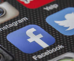 Facebook and Twitter apps on phone among others