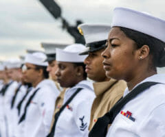 Navy personnel standing at attention in uniform