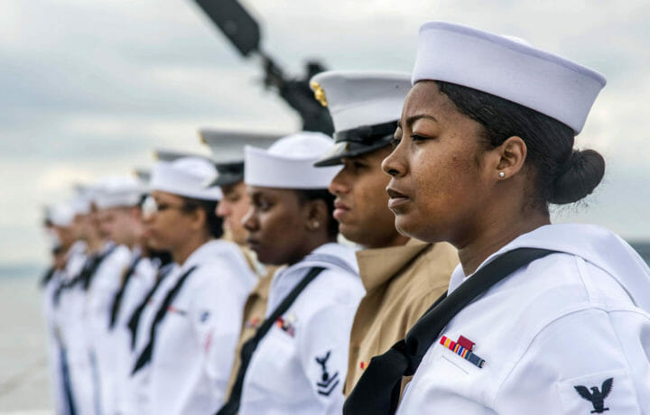 Navy personnel standing at attention in uniform