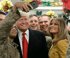 Military personnel taking selfie with President Trump and First Lady Melania Trump