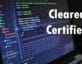 Computer with code and the words cleared and certified