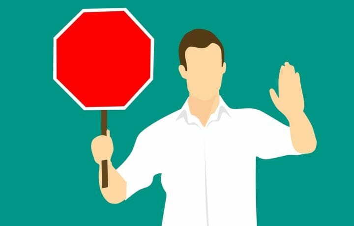 Illustration of man holding stop sign