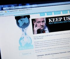 Photo of WikiLeaks website with Julian Assange