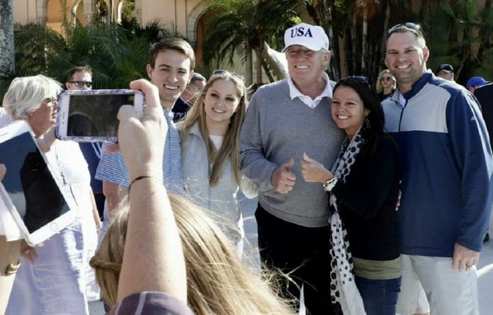 Supporters posing for photo with President Trump at Mar-a-Lago