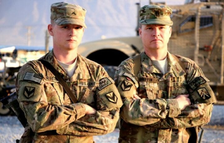 Pvt. Chris Griffin and Command Sgt. Maj. Ian Griffin posing