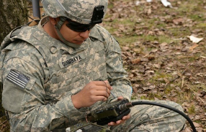 Man in uniform working with GPS receiver