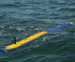 unmanned knifefish submarine partially submerged under water