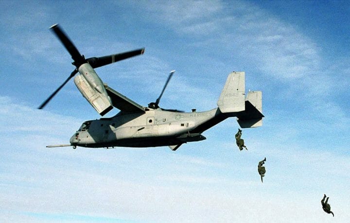 Marines jumping from a V-22 Osprey