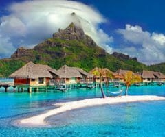 Bora Bora beach with villas and mountain
