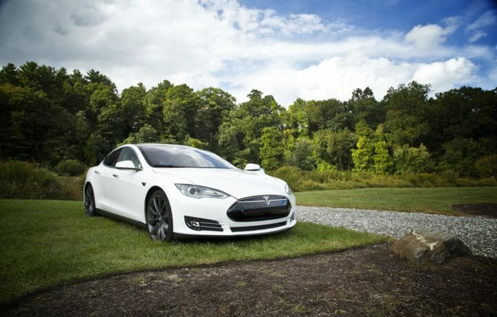Tesla car in field