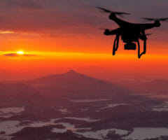 drone in sky at sunset