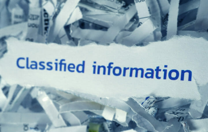 classified information with shredded paper