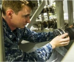 NEWPORT NEWS, Va. (July 16, 2015) Fire Controlman 2nd Class Michael Perez, assigned to Pre-commissioning Unit Gerald R. Ford (CVN 78) installs a pump in the Dual Band Radar cooling system during routine maintenance.