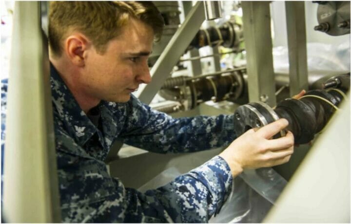 NEWPORT NEWS, Va. (July 16, 2015) Fire Controlman 2nd Class Michael Perez, assigned to Pre-commissioning Unit Gerald R. Ford (CVN 78) installs a pump in the Dual Band Radar cooling system during routine maintenance.