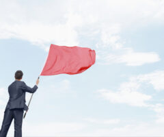 Businessman waving a red flag