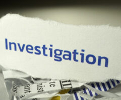 investigation written on shredded paper