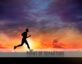 man running with sunset in background