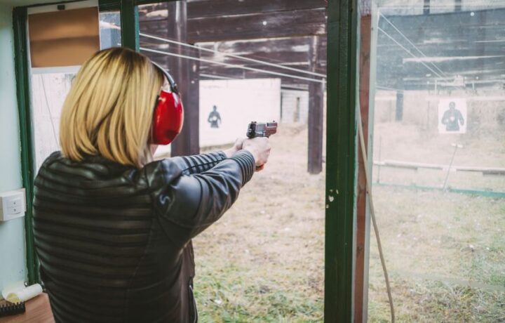 woman shooting gun at target