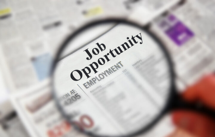 magnifying glass on Job Opportunity employment