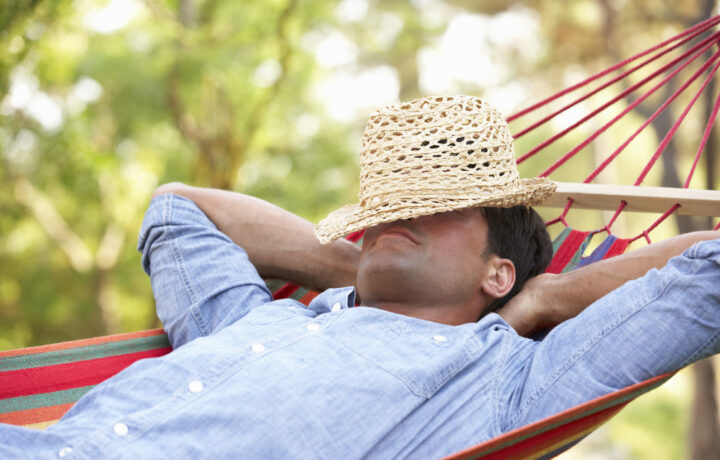 man relaxing in hammock summer vibes