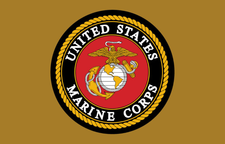 Marine Corps logo against a brown/yellow background.