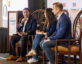 Simone Berry moderates the “AI Expertise in Action” panel at ClearanceJobs Connect 2025 West in San Diego, seated onstage with Lisa Tsyvine of Deloitte and Aaron Guzman of Google Cloud. All three are holding microphones, engaged in a discussion on AI’s impact in national security.