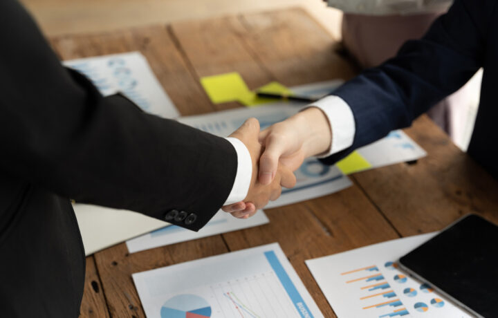 mergers and acquisition business deal handshake