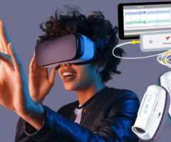 A person wearing a virtual reality headset and reaching out with one hand, accompanied by a connected device labeled "freespira" with cables and a tablet displaying graphs, alongside two handheld white electronic devices with buttons.